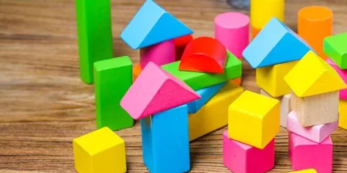 building-blocks-wooden-background-colorful-wooden-building-blocks_1205-1629-1